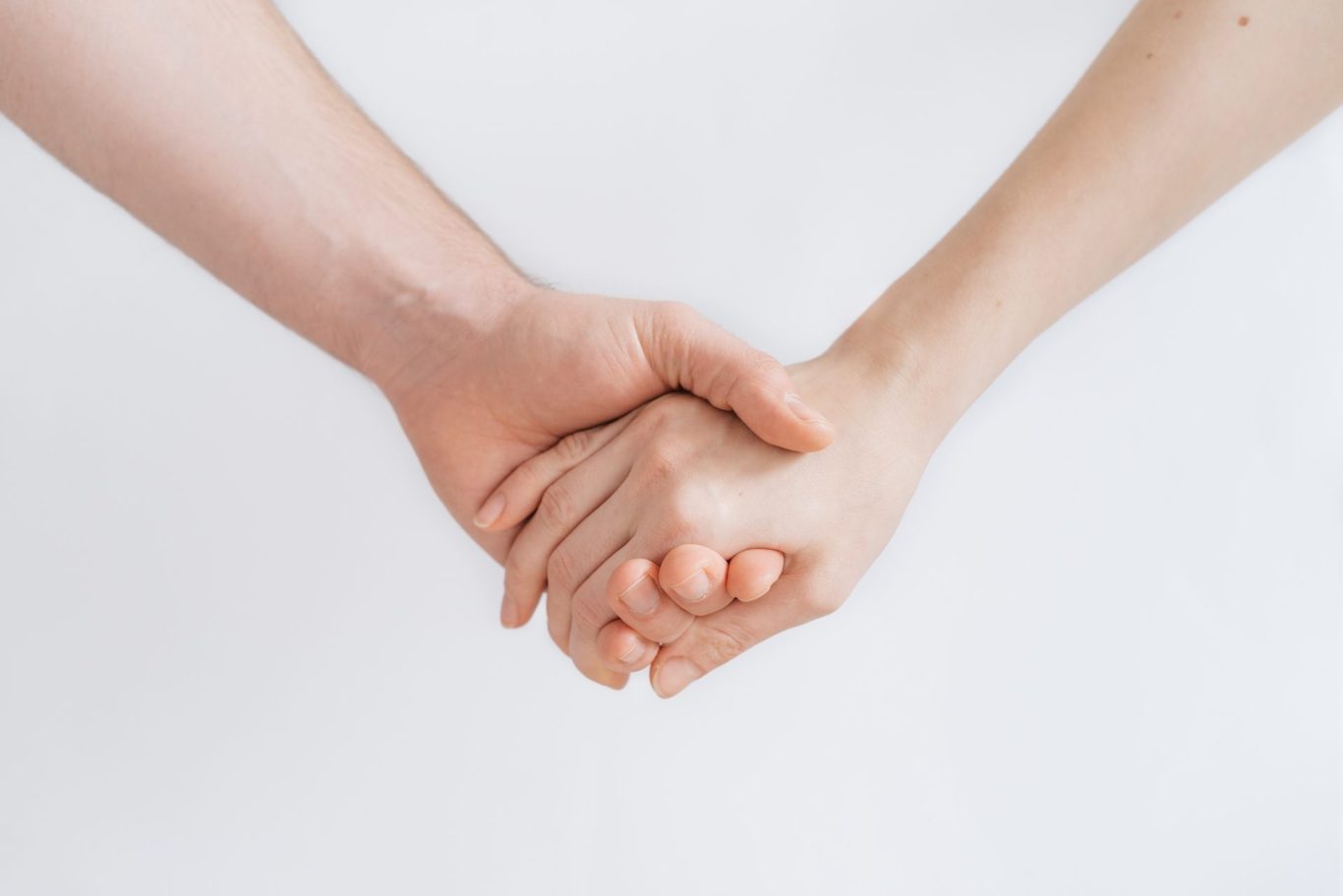 Two people holding hands representing the trust and connection at the heart of psychotherapy at Inner Growth Pathways, Horsham
